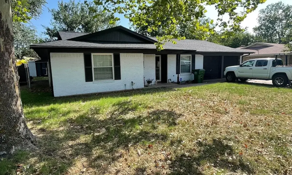 Professional roofing crew working on a residential roof in White Bear Lake